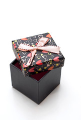 hand-made opened black gift box with hearts shape