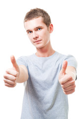 Fototapeta premium Positive young man with thumbs up