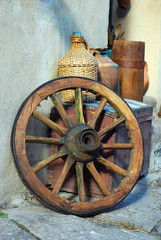 set of antiquities	wagon wheel, chest and wine bottle