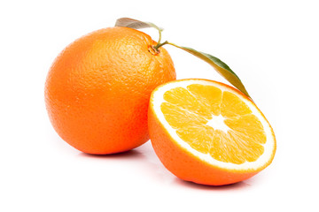 Orange and sliced orange with leaves on white background