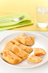 tasty tuna patty with tomato and pepper