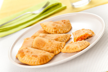tasty tuna patty with tomato and pepper