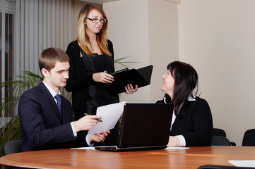 Command of businessmen at office