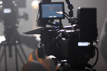 Digital cinema camera on a foggy/smoky movie set - obrazy, fototapety, plakaty