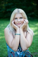 Fototapeta premium Pretty spring woman with pure healthy skin in the garden