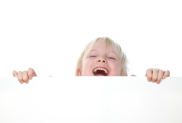 Nice little girl with blue eyes laughing heartly