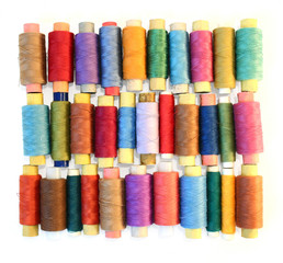 reels of color threads on white