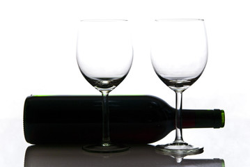 bottle of wine and wineglasses on white background