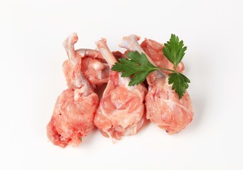 Raw skinless chicken drumsticks