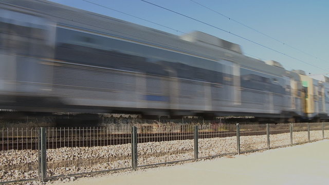 Two commuter train  passing by