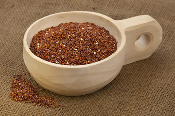 scoop of red quinoa
