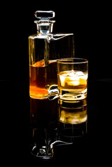 carafe of scotch whiskey or bourbon and drink with ice