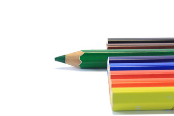 wooden color pens with focus on green pen