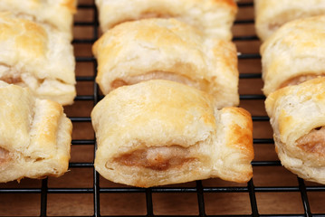 sausage rolls on cooling rack