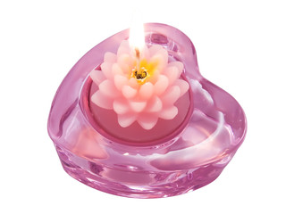 Aroma candle lotus in heart candlestick on a white close-up