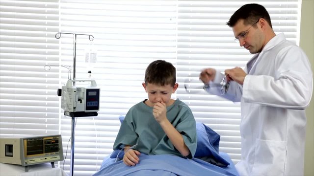 Doctor Checking the Sick Child in Hospital