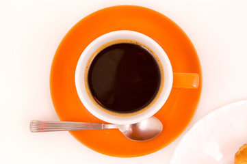 Orange cup with coffee