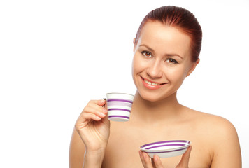 smiling young woman with coffee cup
