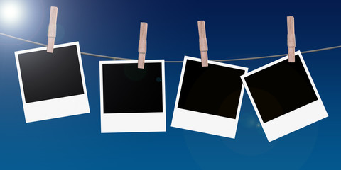 4 polaroids hanging on a rope