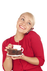 young blond woman holding a phone and cap of coffee