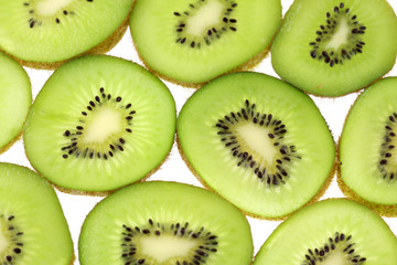 Fototapeta premium tranches kiwis fond blanc