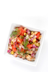 some fresh organic herring salad  in a bowl