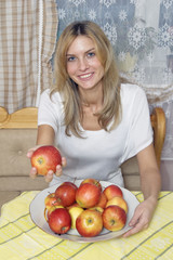 The girl with apples, at home