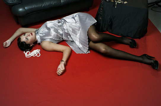 Dead woman lying on the floor