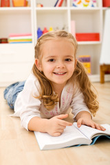 Little girl learning to read
