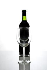 bottle of wine and wineglasses on white background