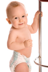 Smiling baby stands