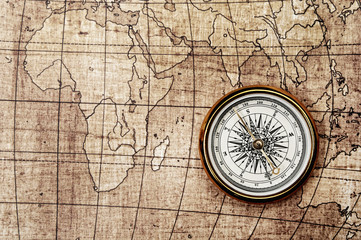 Fototapeta na wymiar Compass on old map.