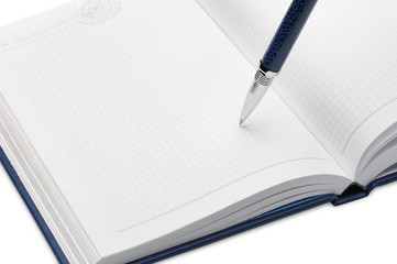 Pen above a notebook