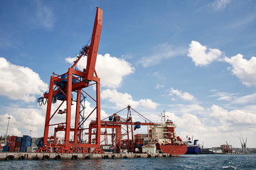 Industrial harbor with large container crane bridge