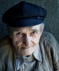 Portrait of one friendly old senior man