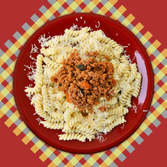 Dish of italian fusilli pasta and bolognese sauce.
