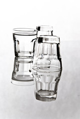 couple of shot glasses on white background