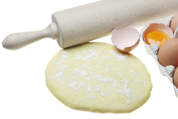 Eggs,dough and rolling pin.