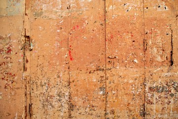 Aged grunge wooden pink orange painted door