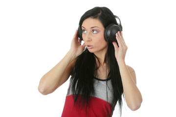 Fototapeta premium Young beautiful happy women listening music