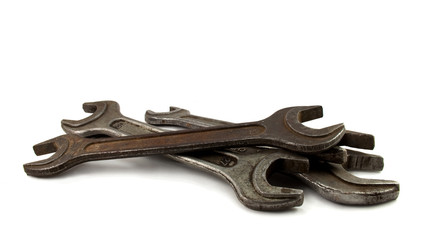 old rusty spanners on white background