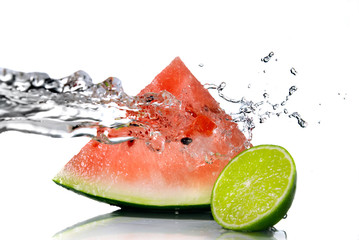 watermelon with lime and water splash isolated on white