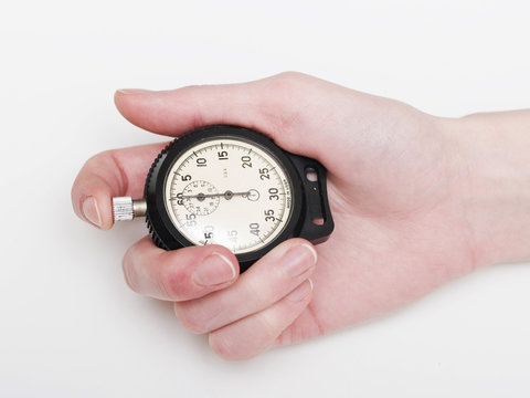 female hand holding the stop-watch