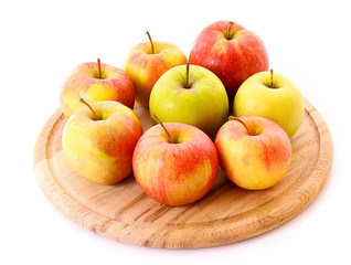 Few apples on wooden tray isolated on white