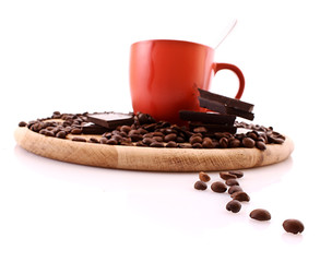 Chocolate, coffee beans and cup with coffee