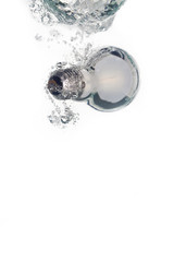 A lightbulb falling into clear water