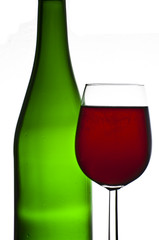 Bottle and glass of red wine isolated on white background