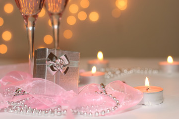 Gift box with festive decor, ribbons and beads