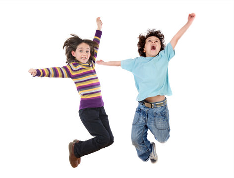 Two happy children jumping at once