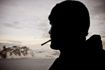 Silhouette of male smokers